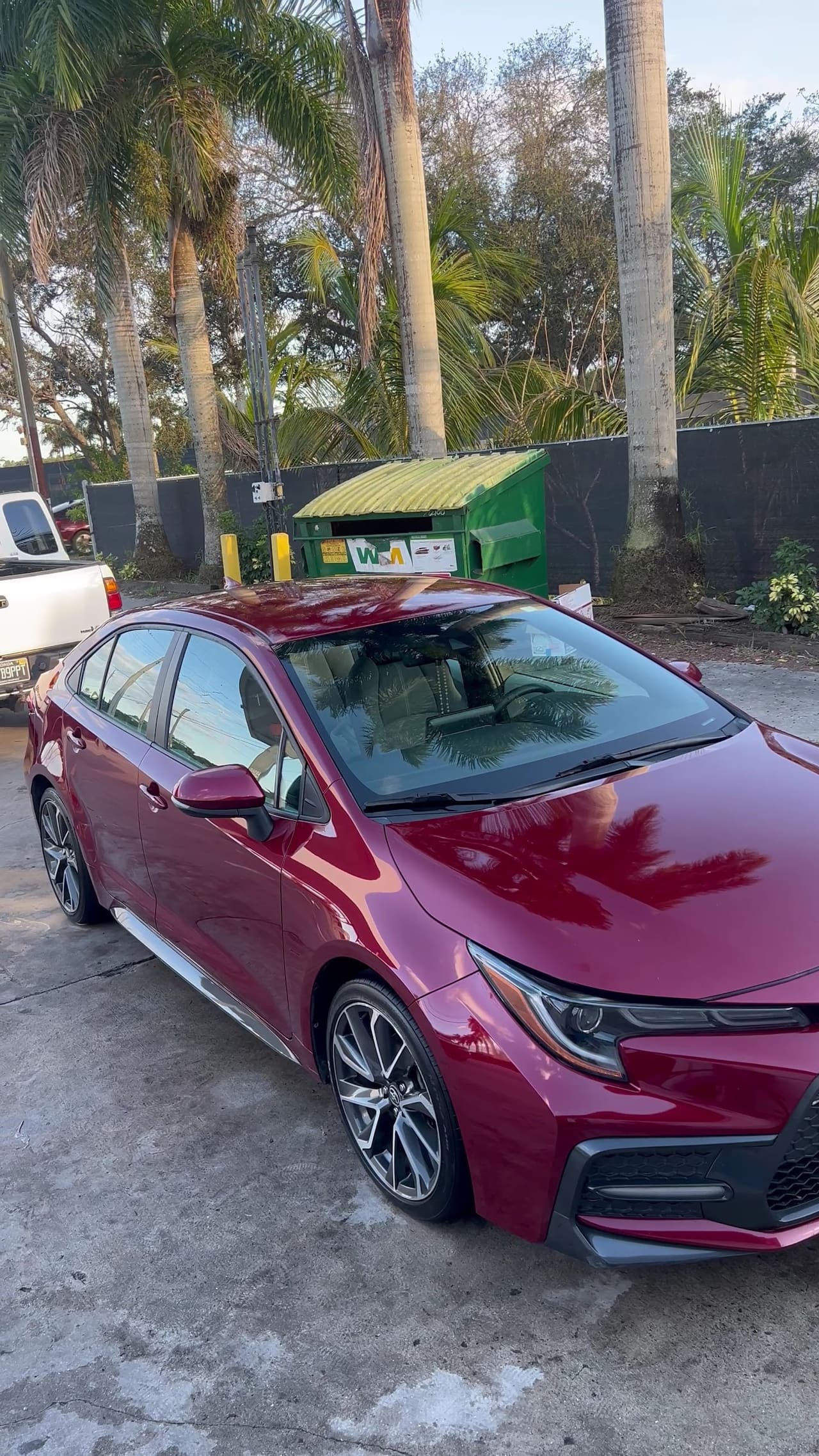 Red Toyota Corolla detailed and parked outside