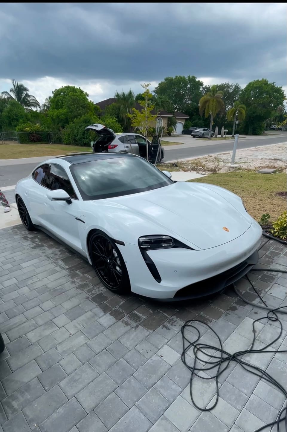 White Porsche Taycan after a full detail