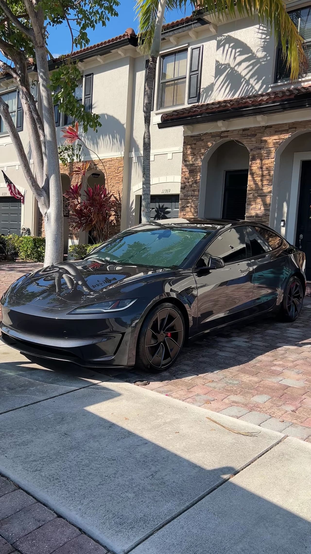 Black Tesla detailed outside a Homestead townhouse